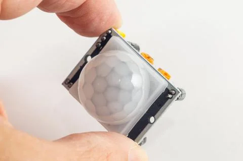 IR motion sensor in hand for a DIY smart home Stock Photos