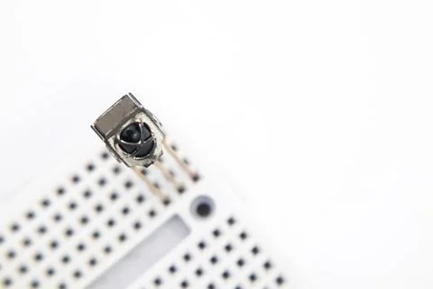 An IR receiver embedded in a project board on a white background. This part i Stock Photos