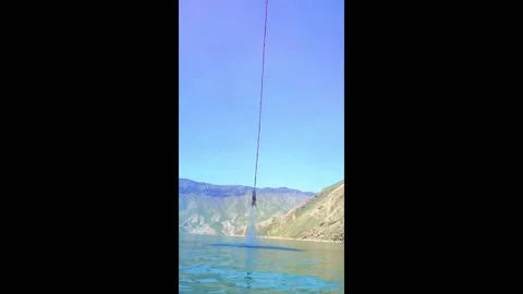 Iran: Bungee jumping dive into Khuzestan waters Stock Footage 276529377