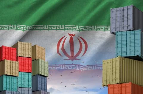 Iran flag and big stack of shipping cargo containers in docks with sky Stock Photos