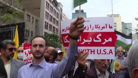Iran: Iranians rally in Tehran, protesting against US hegemony, Israeli v... Stock Footage 290371272