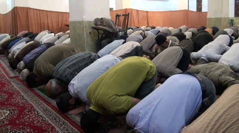 Iran, men praying inside mosque Stock Footage 33650152