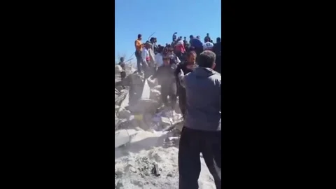 Iran: Rescue Effort Captured After Building Destroyed in Ilam Video stock 330113852