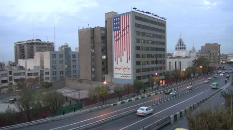 Iran Tehran 'Down with the USA' building contrasts with church Stock Footage 33906503