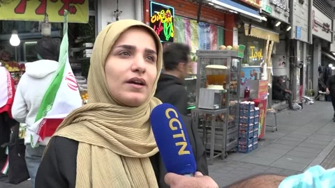 Iran: Tehran residents express deep distrust toward US as talks stall Stock Footage 332652997