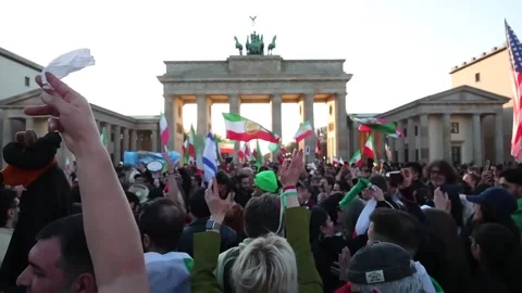 Iranian exiles protest in Berlin after Khamenei's death in joint US-Israel attac Stock Footage 329940283