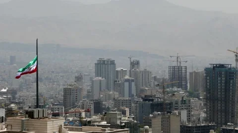 Iranian flag waving in the middle of Tehran the capital city of Iran Video stock 66542453