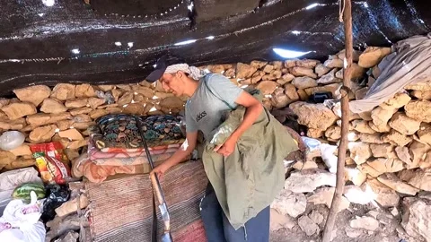 Iranian Nomad Returns to Tent with Hunting Catch | Life in the Mountains Stock Footage 317762167