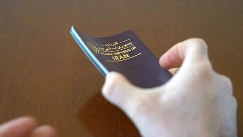 Iranian passport browsing Stock Footage 125535053