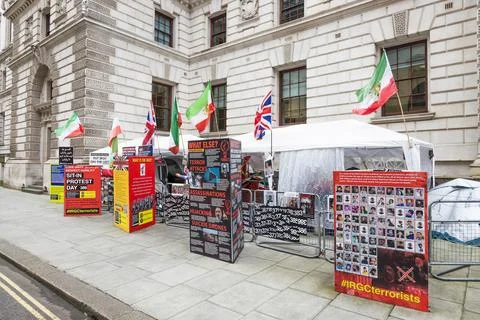 Iranian protest camp with flags outside government building. London, UK, 16 Stock Photos