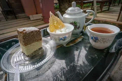 Iranian tea set with cake and saffron rock sugar. Traditional tea in a local Stock Photos