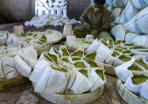 Iranian Worker Packing Henna Bags In A Traditional Mill, Yazd Province, Yazd, Stock Photos