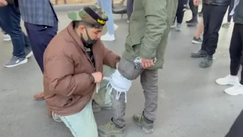 Iraq: Protesters rally outside US embassy in Baghdad over Khamenei killin... Stock Footage 329906242