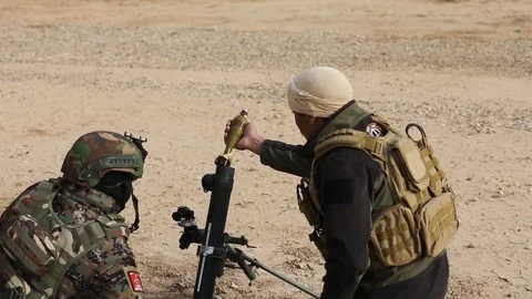 Iraqi soldier loading rocket launcher at Besmaya live fire range Stock Footage 85729627