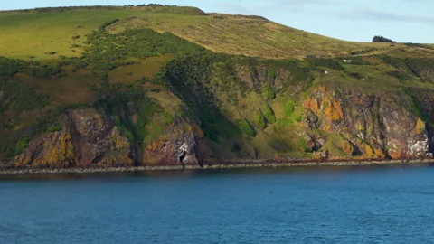 Ireland Coast Light and Shadow on rocky cliffs Stock Footage 317836403
