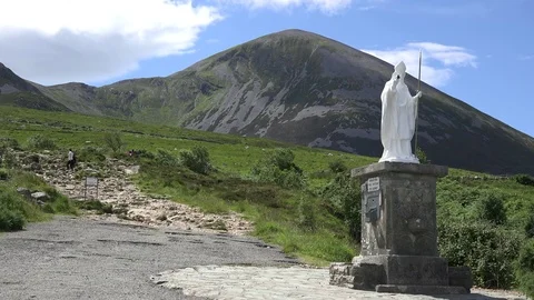 Ireland Croagh Patrick statue and path up mountain Stock Footage 82244012