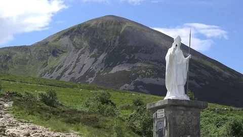 Ireland Croagh Patrick statue and path up mountain zoom.mov Stock Footage 82244986