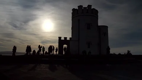 Irelans, Cliffs of Moher, 11-25-2025. Silhouette O'Brien's Tower. Slow motion 4K Video stock 330484063