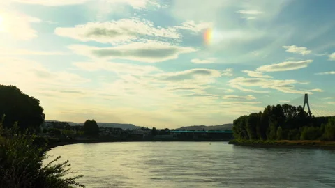 Iridescent cloud during sunset over the Rhine river in Neuwied Germany Stock Footage 202605503