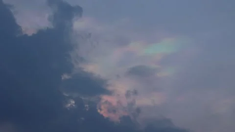 Iridescent Cloud Formation With Vibrant Rainbow Colors Drifting Across Video stock 342324666
