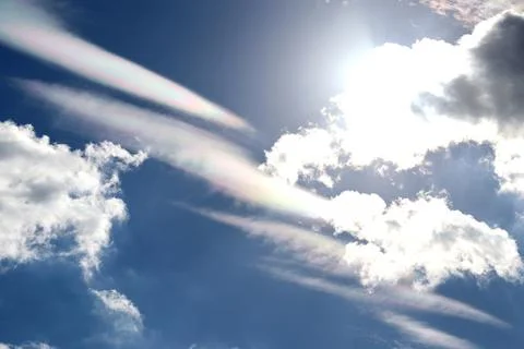 Iridescent clouds in the blue sky Stock Photos