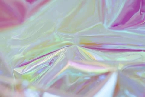 Iridescent plastic wrap abstract background with vibrant colors and soft glowing Stock Photos