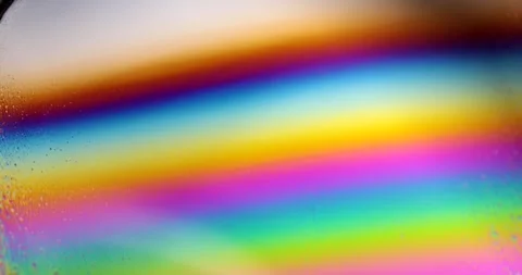 Iridescent Rainbow Spectrum on Soap Solution Film Surface | Macro Fluid Stock Footage 346168543