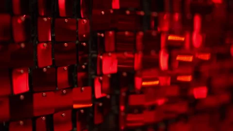 Iridescent red sequins hang on the wall as a beautiful backdrop Stock Footage 323456111