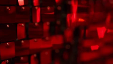 Iridescent red sequins hang on the wall as a beautiful backdrop Stock Footage 323456155