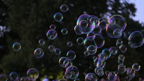 Iridescent soap bubbles floating in the air 库存影片 343495007