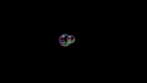 Iridescent Soap Bubbles Floating on Black Background Vídeo Stock 346394494