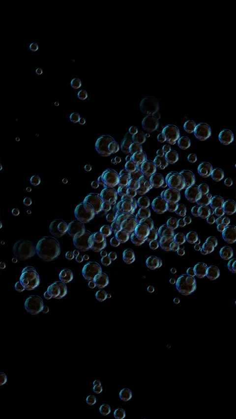 Iridescent soap bubbles floating upwards on black background Stock Footage 342279839