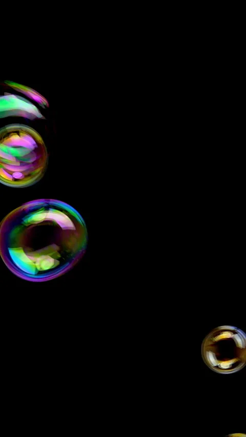Iridescent soap bubbles rise against black Stock Footage 344998143