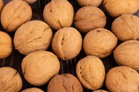 IRipe walnuts in the shell, the theme of healthy eating, vegetarianism, raw f Stock Photos