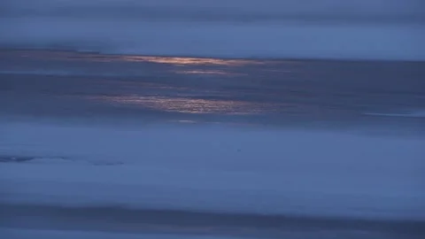 Irisated glare of sunset on the icy surface of Baikal. From close-up to horizon Stock Footage 140961908