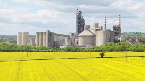 Irish Cement Facility and Silos Surrounded by Farm Land in Rural Ireland. Stockbeeldmateriaal 345124307