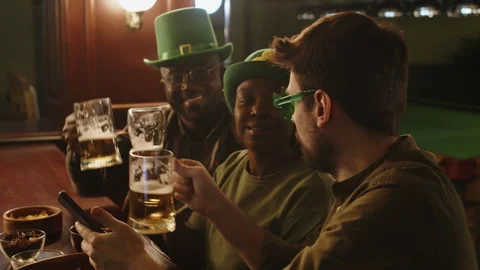 Irish Friends Drinking Beer at Bar Counter on St Patricks Day Stock Footage 290454604