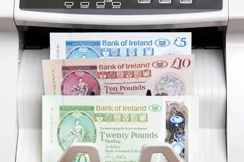 Irish pound in the counting machine Stock Photos