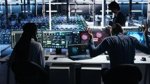 Irked data center programmer smashing desk, upset by malfunctioning AI gear 写真素材