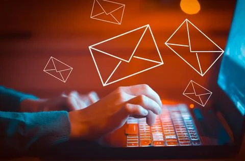 Irl sends letters, emails using her laptop, hands on keyboard closeup. Stock Photos