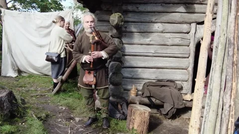 An iron age bag pipe player Stock Footage 249483257