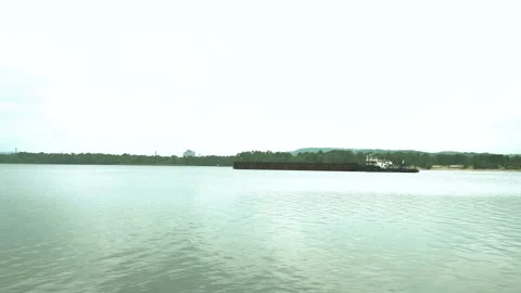 Iron barge sailing on empty calm river. empty barge floating on the river. toned Stock Footage 151111866