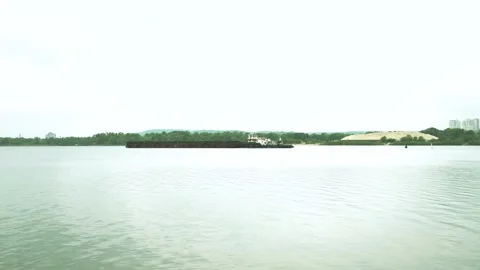 Iron barge sailing on empty calm river. empty barge floating on the river. toned Stock Footage 151111929