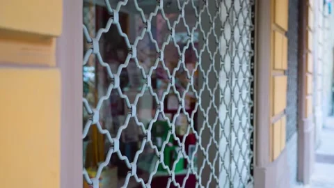 Iron bars security shutter grate protects big shop window 動画素材 162219496