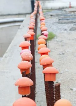 Iron bars on a work whith plastic caps Stock Photos