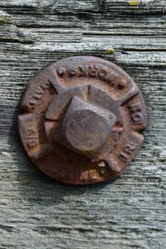 Iron Bolt and Washer Securing Weathered Wood Bridge Stock Photos