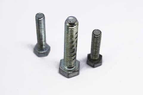 Iron bolts on white background Stock Photos