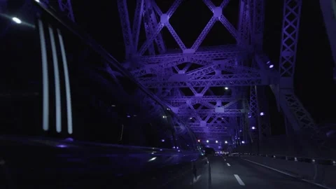 Iron bridge framework at night with reflection on limousine window Vídeos de archivo 167672639