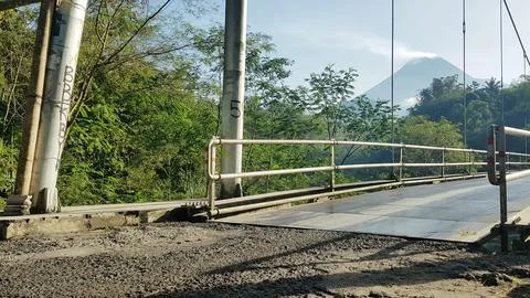 Iron bridge with Mount Merapi in the Background Fotos de archivo