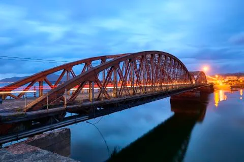 Iron Bridge over the Ason river at evening, Colindres, Cantabria, Spain 스톡 사진